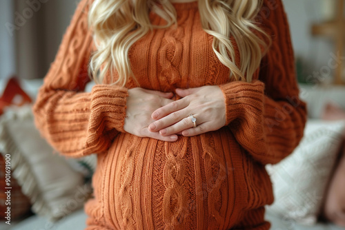 Pregnant woman holding her lower back, red showing back pain
