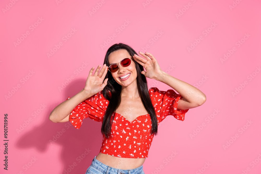 Photo of pretty young woman toothy smile wear top isolated on pink color background Photo of pretty young woman toothy smile wear top isolated on pink color background