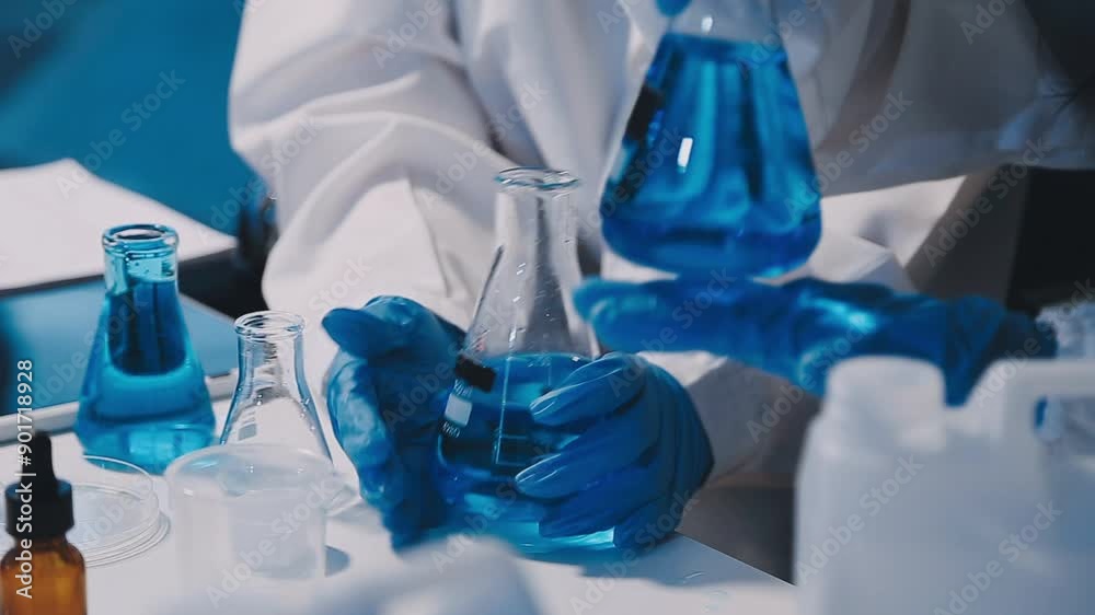 chemist,scientist hand dropping chemical liquid into test tube, science research and development concept chemist,scientist hand dropping chemical liquid into test tube, science research and development concept