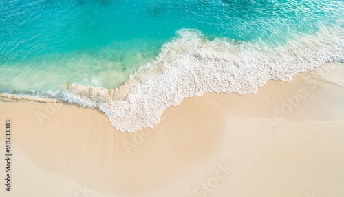 Beautiful tropical summer beach, top view of white sand and blue sea waves, nature background, vacation in paradise concept for tourism, vivid colorful.