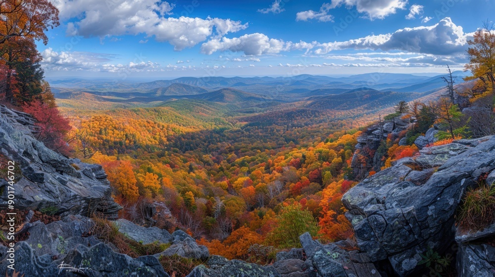 Fototapeta premium Wide-angle view of an autumn mountain landscape, capturing the vibrant colors and expansive scenery.