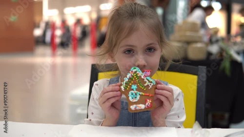A Child Enthusiastically Enjoys the Fun and Creative Gingerbread Decorating Activity