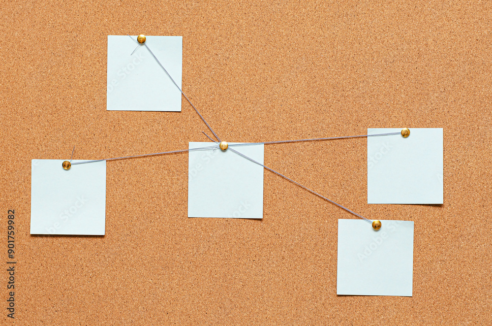 Blank paper notes are pinned to a cork board. The concept of detective investigation or training. Copy space. Blank paper notes are pinned to a cork board. The concept of detective investigation or training. Copy space.