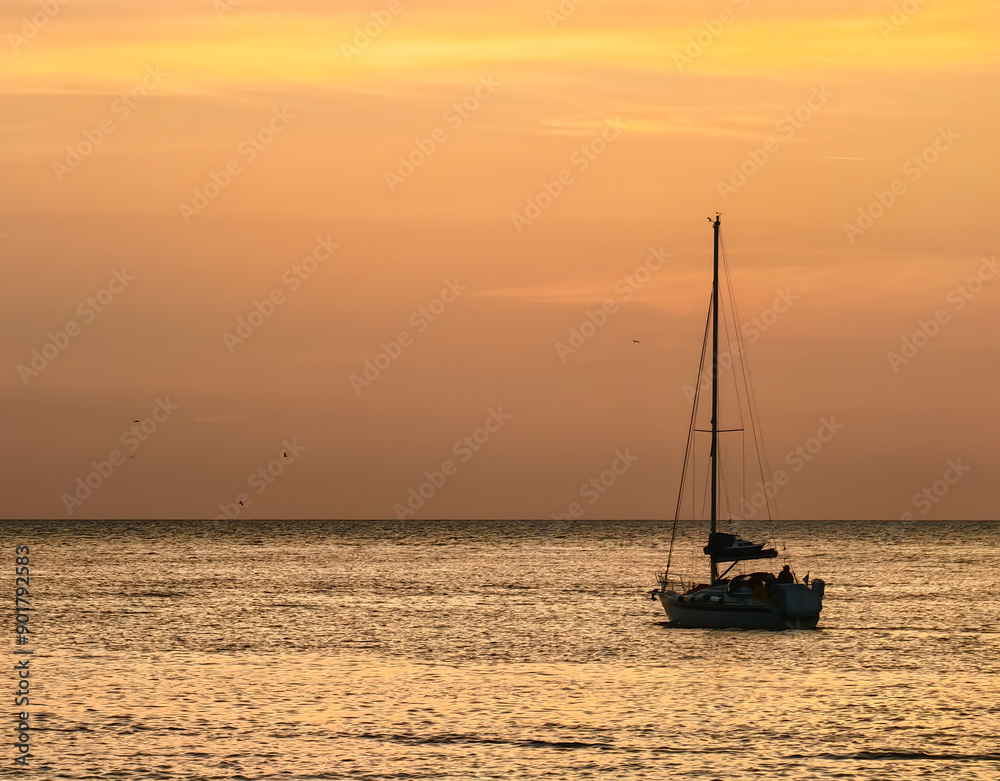 Beautiful sailboat on a tranquil Adriatic sea in Pula, Croatia in the evening sunset