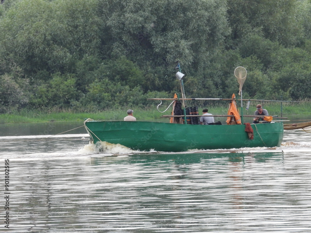 Fototapeta premium fishing boat on the river