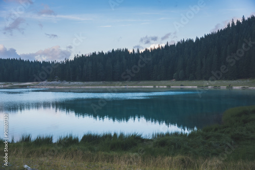 View of beautiful Black lake (Crno jezero) in National park Durmitor, Zabljak, Montenegro with turquoise water and trees. Scenic nature landscape photo