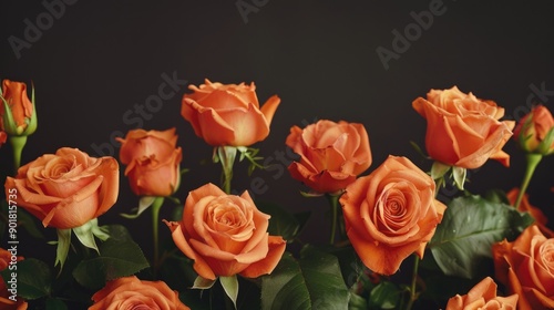 A bouquet of fresh orange roses arranged in a decorative vase, perfect for decorating or gifting