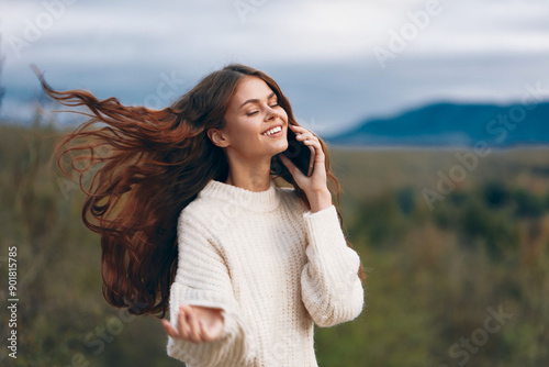 Mountain Woman's Phone Call: Adventure, Freedom, and Connection in Nature © SHOTPRIME STUDIO