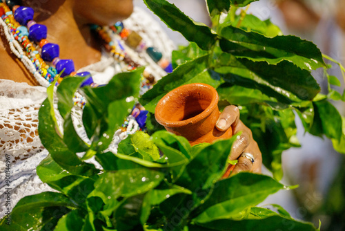 clay vase in a woman's hand during an iemanja party in Rio de Janeiro. photo