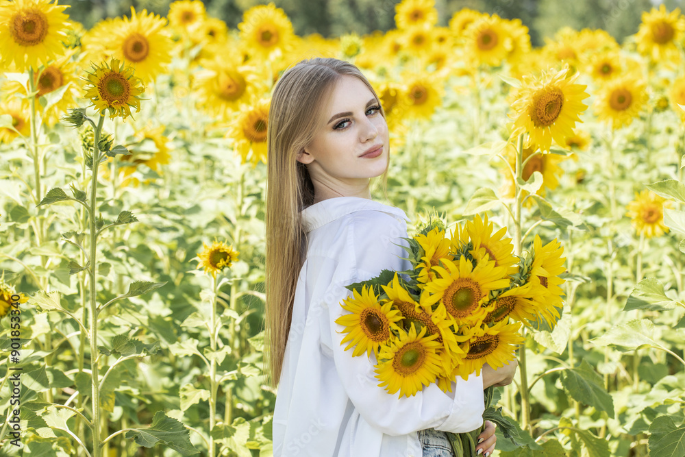 Young beautiful woman with a bouquet of sunflowers Young beautiful woman with a bouquet of sunflowers