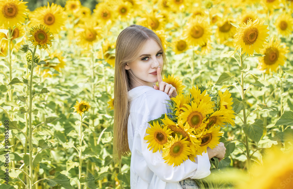 Young beautiful woman with a bouquet of sunflowers Young beautiful woman with a bouquet of sunflowers