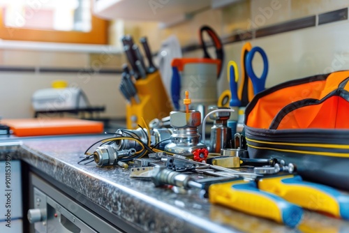 Close-up of plumbing equipment and tools on a kitchen countertop, highlighting the plumberâ€™s work area and essentials.