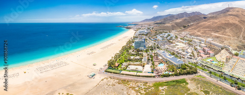 White sandy beach and blue water in Morro Jable, south of Fuerteventura, Canary islands photo