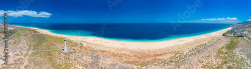 White sandy beach and blue water in Morro Jable, south of Fuerteventura, Canary islands photo