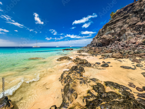 White sandy beach and blue water in Morro Jable, south of Fuerteventura, Canary islands photo