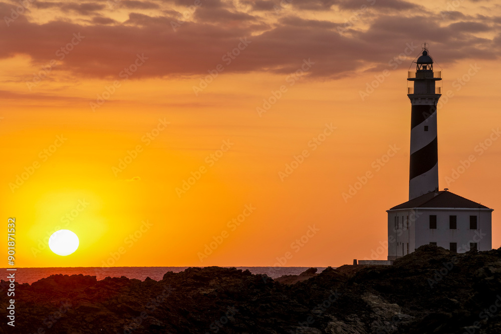 Cape Favaritx lighthouse at sunset, Cap de Favàritx, Menorca, Biosphere Reserve, Balearic Islands, Spain Cape Favaritx lighthouse at sunset, Cap de Favàritx, Menorca, Biosphere Reserve, Balearic Islands, Spain