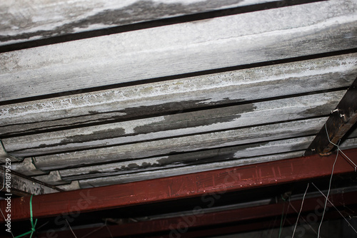  Roof wear. Roof tiles leak water. Rainwater leaks from the roof cause damage to the ceiling and tiles.