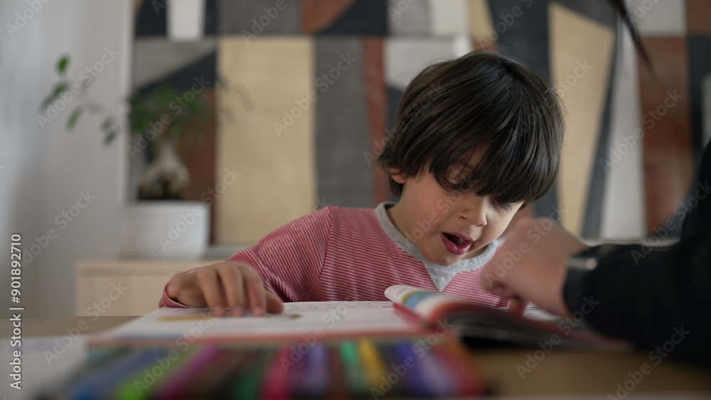 Child yawning while studying with a parent, showing a mix of tiredness and dedication, highlighting the everyday realities of education and parental support at home Child yawning while studying with a parent, showing a mix of tiredness and dedication, highlighting the everyday realities of education and parental support at home