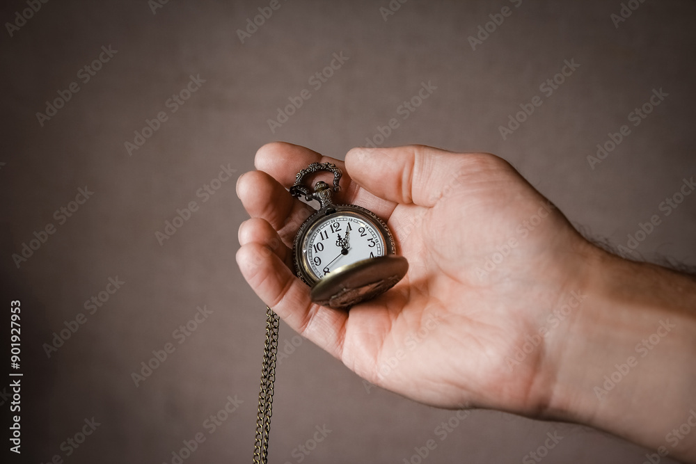 a pocket watch in the hands of a man a pocket watch in the hands of a man