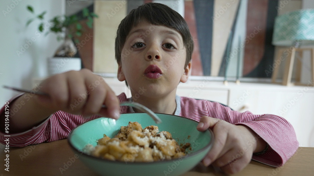 Boy enjoying pasta meal with a fork, emphasizing the joy of eating favorite food, focusing on childhood dining habits and the importance of mealtime, set in a home kitchen environment Boy enjoying pasta meal with a fork, emphasizing the joy of eating favorite food, focusing on childhood dining habits and the importance of mealtime, set in a home kitchen environment