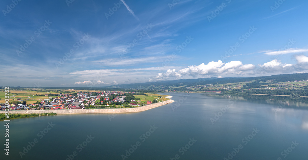 Summer skyline cityscape of Frydman village at Czorsztyn lake (Jezioro Czorsztyńskie) in Lesser Poland (Małopolska), Poland. Wide panoramic aerial view
