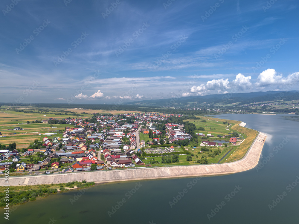 Summer skyline cityscape of Frydman village at Czorsztyn lake (Jezioro Czorsztyńskie) in Lesser Poland (Małopolska), Poland. Wide panoramic aerial view