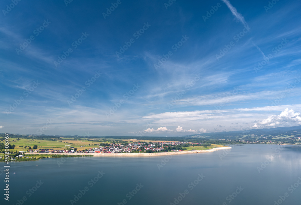 Summer skyline cityscape of Frydman village at Czorsztyn lake (Jezioro Czorsztyńskie) in Lesser Poland (Małopolska), Poland. Wide panoramic aerial view