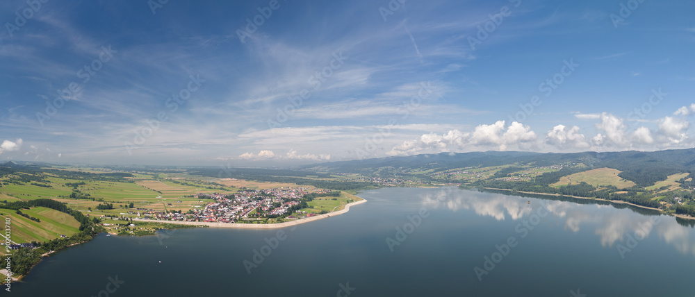 Summer skyline cityscape of Frydman village at Czorsztyn lake (Jezioro Czorsztyńskie) in Lesser Poland (Małopolska), Poland. Wide panoramic aerial view