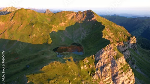 Aerial view of Lake Montagnon in the Pyrénées-Atlantiques, France. Heart-shaped mountain lake at sunrise. photo