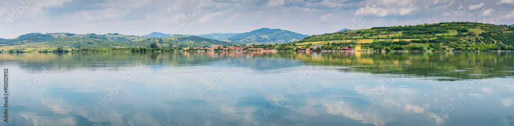 Tranquil landscape of the Danube River at Djerdap Park, with serene waters and lush green hills Tranquil landscape of the Danube River at Djerdap Park, with serene waters and lush green hills