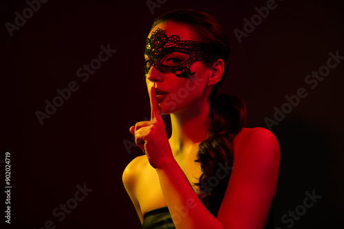 Photo of adorable stunning lady nude shoulders lace mask ask keep secret isolated orange neon light color background