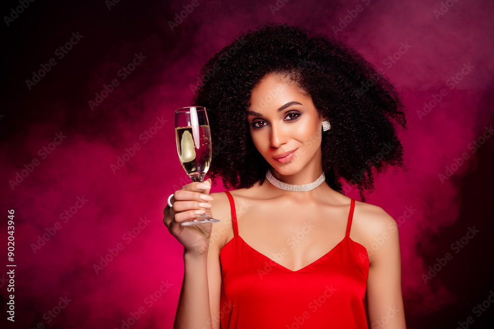 Photo of birthday lady in hot night outfit cheers hold glass with champagne or wine isolated on pink smoke background Photo of birthday lady in hot night outfit cheers hold glass with champagne or wine isolated on pink smoke background