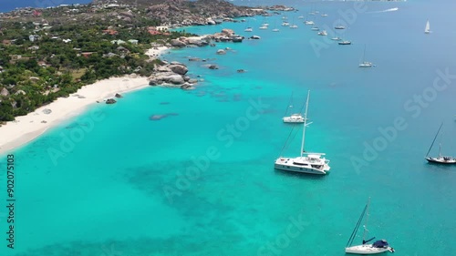 Flying in Reverse and Tilting Up Revealing Anchored Catamarans at Virgin Gorda Island - BVI