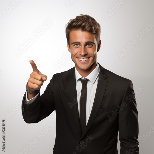 Formal Man Dressed in Suit and Tie Pointing Index Finger, on White Background, Image for Creative Advertisement, Banners, and Advertising in General