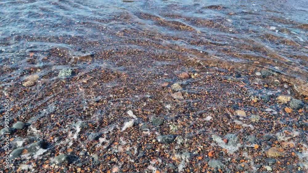 calm waves hitting the red beach in santorini, greece closeup video calm waves hitting the red beach in santorini, greece closeup video