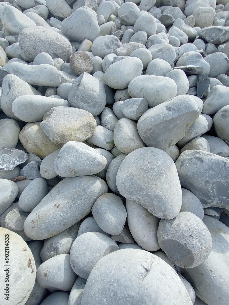 white and grey sea round british stones | texture background white and grey sea round british stones | texture background