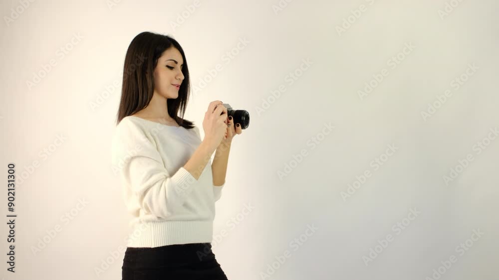 beautiful brunette italian girl shoots with camera in studio. High quality 4k footage beautiful brunette italian girl shoots with camera in studio. High quality 4k footage