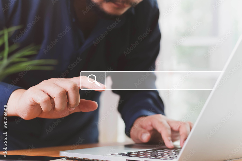 Fototapeta premium Data search technology search engine optimization concept. Man using laptop with virtual Search bar for on website online. SEO search engine optimization concept. Marketing ranking traffic website.