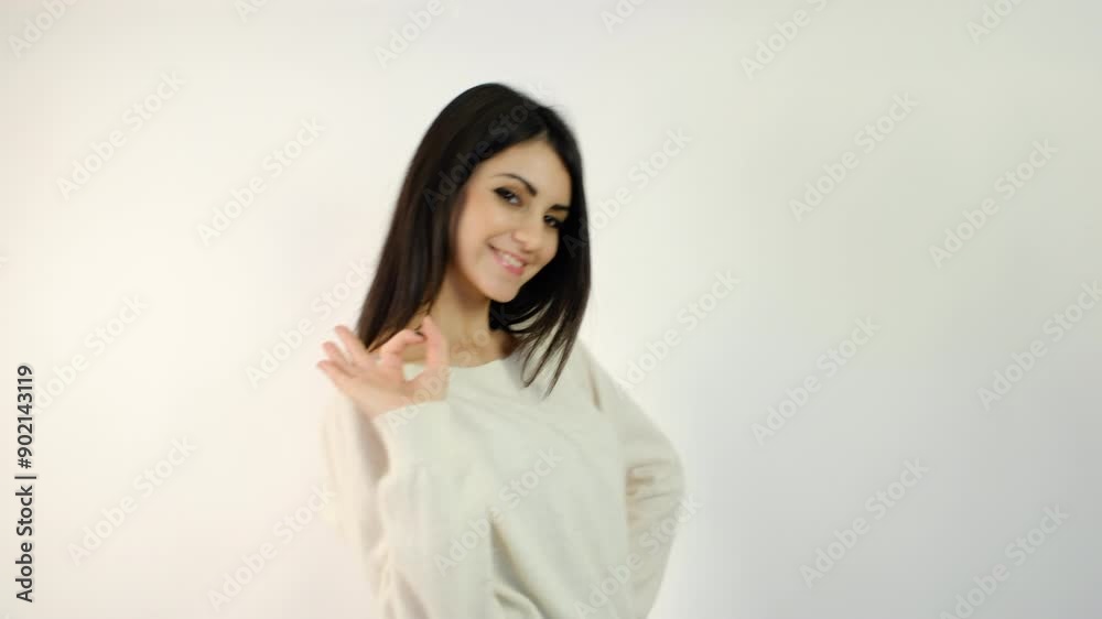 beautiful brunette Italian girl smiles making the ok symbol. High quality 4k footage beautiful brunette Italian girl smiles making the ok symbol. High quality 4k footage
