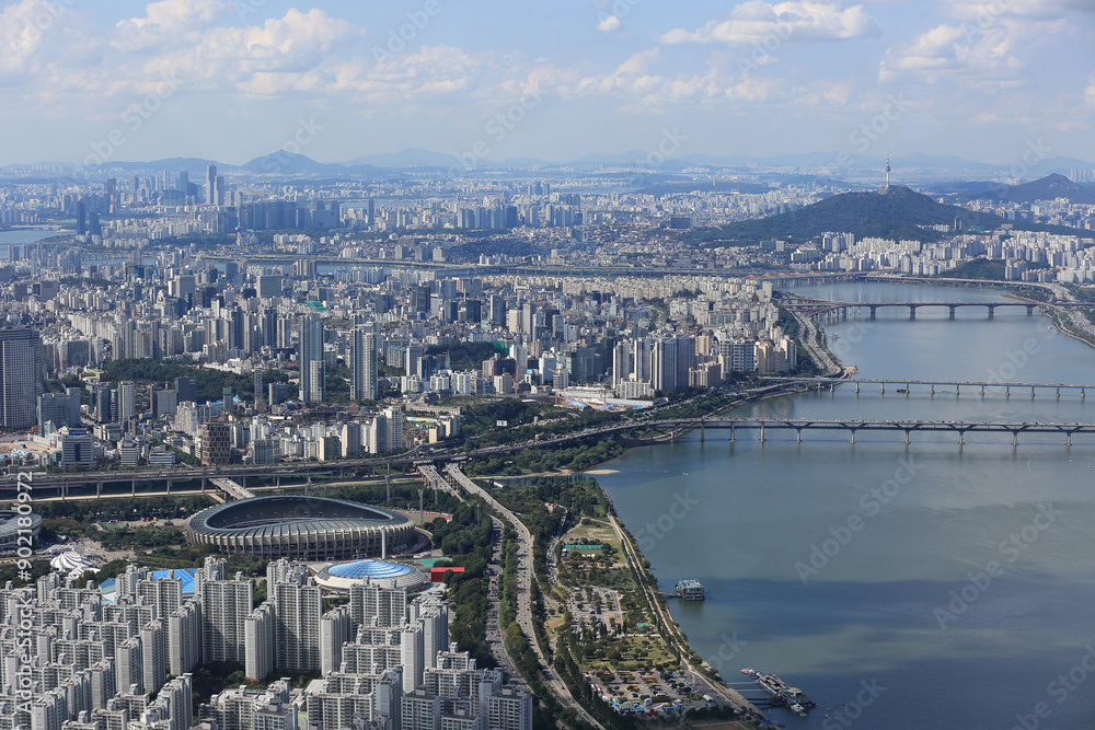 Obraz premium Gangnam-gu, Seoul, South Korea - October 8, 2022: Aerial and summer view of apartments and Jamsil Sports Complex with Olympic Boulevard near Han River 