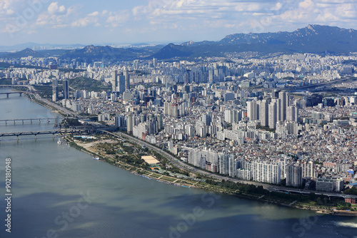 Seongdong-gu, Seoul, South Korea - October 8, 2022: Aerial and summer view of Gangbyeon Expressway and Han River with Ttukseom Hangang Park and apartments
 photo