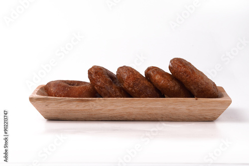 Kue Cincin often called Donut Cake, or Ali Agrem is a cake that is served as a daily snack. It is made from brown sugar mixed with rice flour, on wooden plate photo