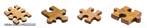 Four Wooden Puzzle Pieces on a Black Background