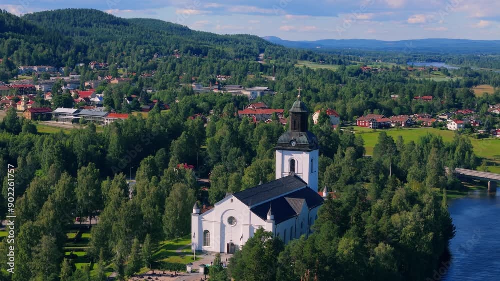 Aerial view of church of tourist resort Järvsö, Sweden during summer sun. Close up. Drone Flyover Aerial view of church of tourist resort Järvsö, Sweden during summer sun. Close up. Drone Flyover