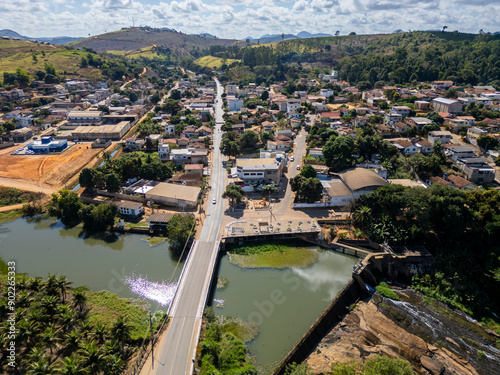 Aerial Drone view of the bridge over Sao Jose river and the small hydroelectric dam in Sao Gabriel da Palha, ES, Brazil photo