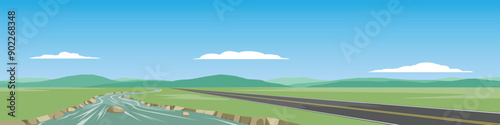Horizontal or landscape of smooth asphalt road beside a river. Surrounded by green grass with mountain under the blue sky and white clouds.