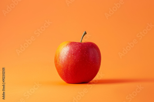 red apple on a oringe background photo