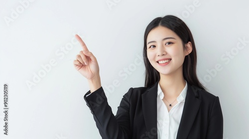 Woman smiling and pointing at copy space on side,isolated on white background,web banner.