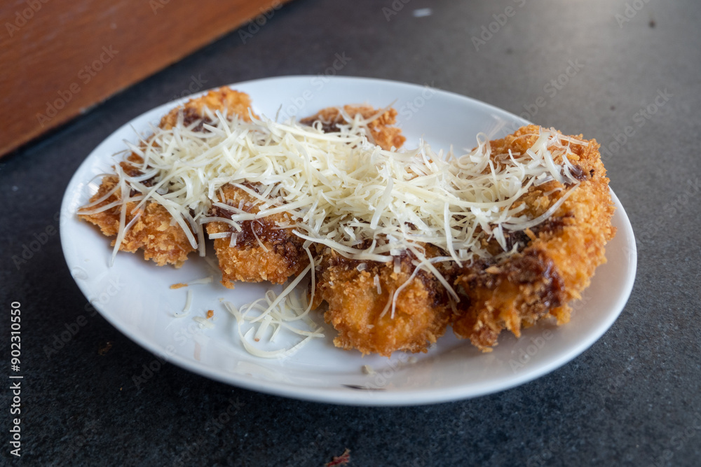 sweet fried bananas topped with chocolate and cheese sweet fried bananas topped with chocolate and cheese