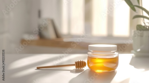 honey jar and stick on table